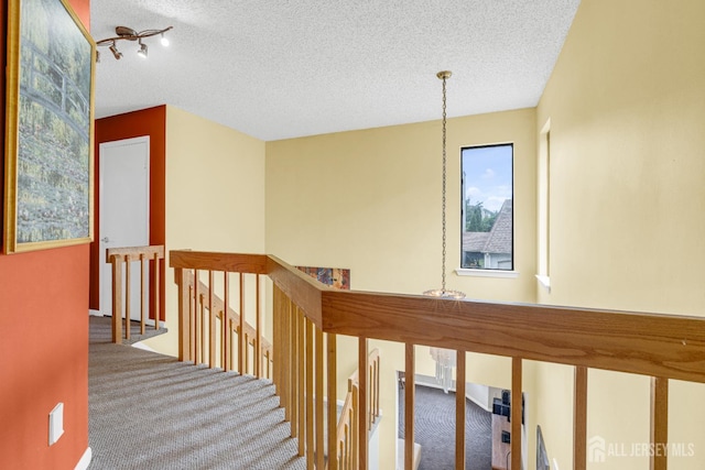 47 Park Gate Dr, Edison, NJ 08820 - corridor featuring an upstairs landing, carpet flooring, and a textured ceiling