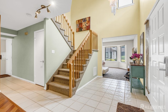 47 Park Gate Dr, Edison, NJ 08820 - foyer entrance with stairway, light tile patterned floors, and a towering ceiling