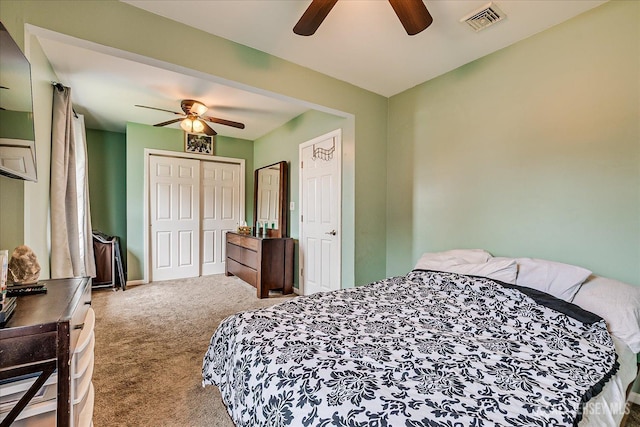 bedroom with carpet floors, a closet, a ceiling fan, and baseboards