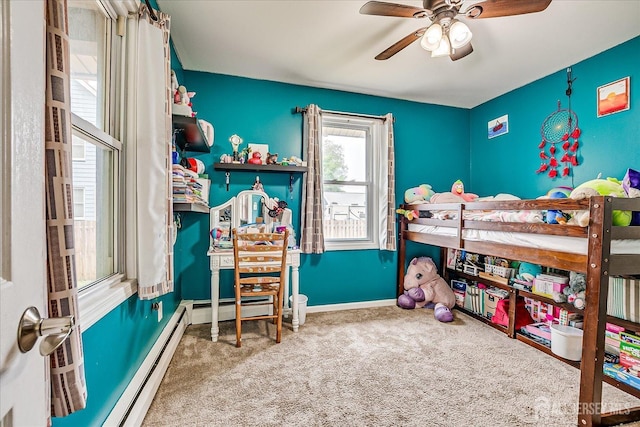 bedroom featuring carpet flooring, a baseboard radiator, baseboards, and a ceiling fan