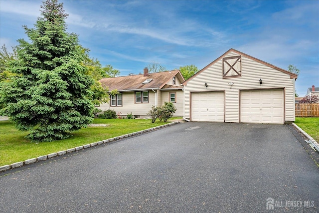 view of front of house with an outdoor structure and a garage