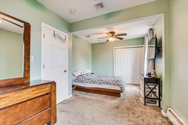 bedroom with baseboard heating, carpet flooring, baseboards, and ceiling fan