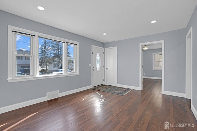 entrance foyer featuring baseboards, visible vents, wood finished floors, and recessed lighting