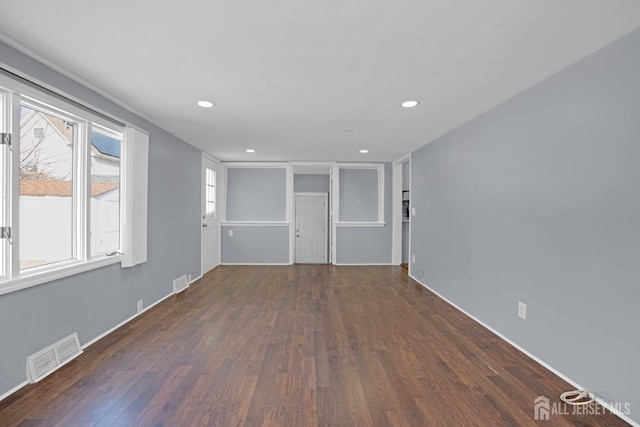 spare room with visible vents, wood finished floors, and recessed lighting