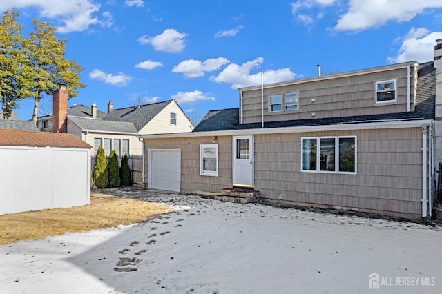 view of front of property with entry steps and an attached garage