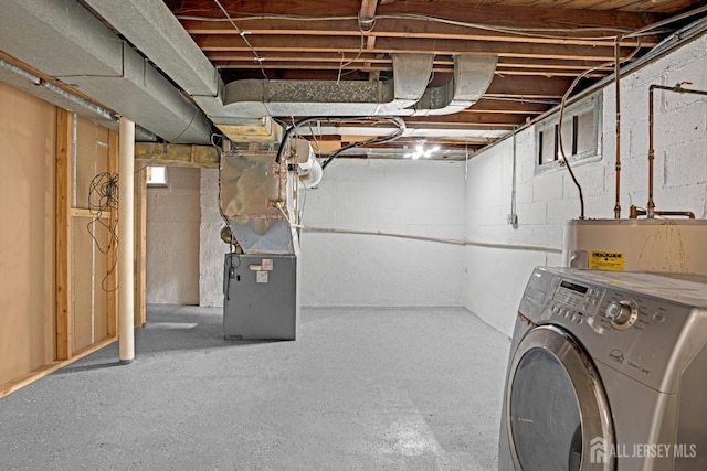 basement featuring washer / dryer, water heater, and heating unit