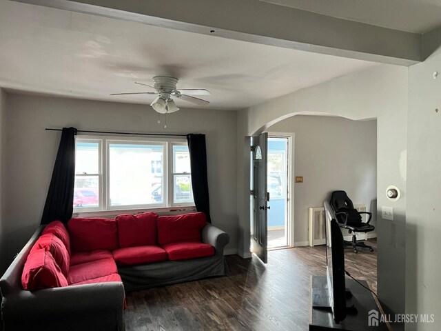 living room featuring hardwood / wood-style flooring, ceiling fan, and a healthy amount of sunlight