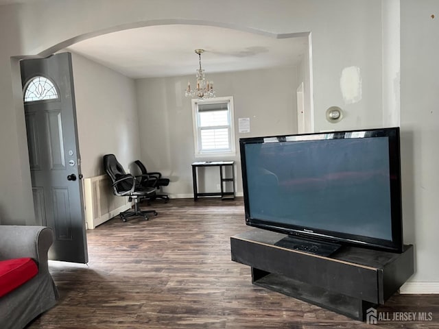 miscellaneous room with dark hardwood / wood-style floors and radiator heating unit