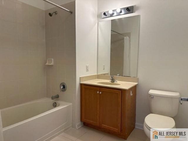 full bath with tile patterned flooring, toilet, vanity, and bathtub / shower combination