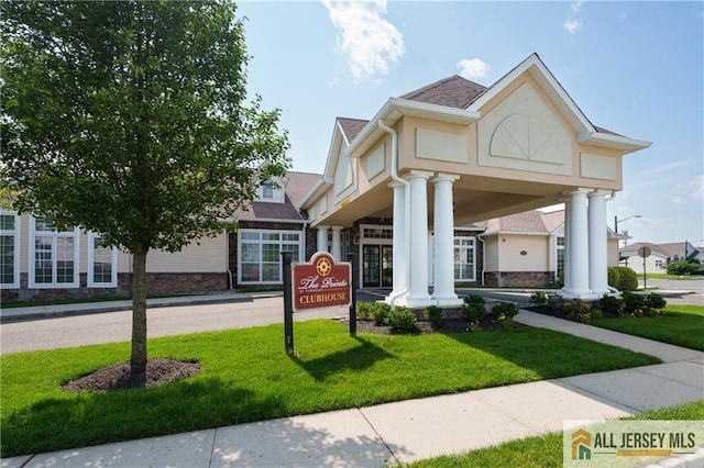 704 Schindler Dr, South Brunswick, NJ 08852 - view of front of house with a front lawn and stone siding