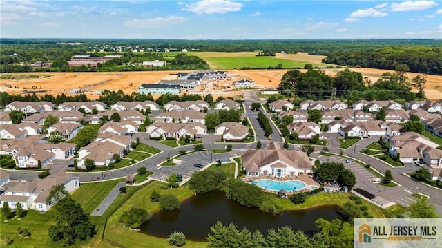 704 Schindler Dr, South Brunswick, NJ 08852 - aerial overview of property's location with a pool and a nearby body of water