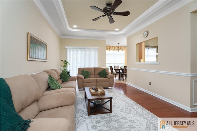 704 Schindler Dr, South Brunswick, NJ 08852 - living room with wood finished floors, ceiling fan, ornamental molding, a raised ceiling, and recessed lighting
