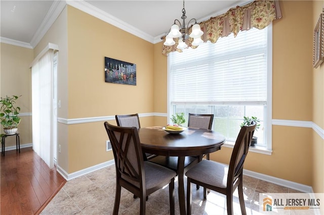 704 Schindler Dr, South Brunswick, NJ 08852 - dining space with a chandelier and crown molding