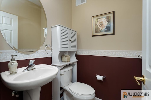 704 Schindler Dr, South Brunswick, NJ 08852 - bathroom with toilet and wallpapered walls