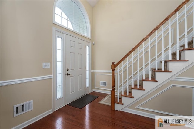 704 Schindler Dr, South Brunswick, NJ 08852 - foyer featuring wood finished floors and stairs