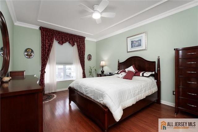 704 Schindler Dr, South Brunswick, NJ 08852 - bedroom with dark wood-style floors, a raised ceiling, ornamental molding, and ceiling fan