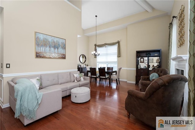 704 Schindler Dr, South Brunswick, NJ 08852 - living area featuring a chandelier, beam ceiling, wood finished floors, high vaulted ceiling, and a fireplace