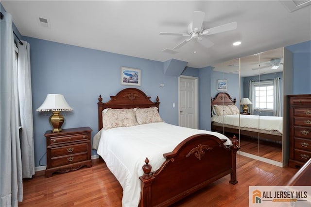 704 Schindler Dr, South Brunswick, NJ 08852 - bedroom with wood finished floors, ceiling fan, and recessed lighting