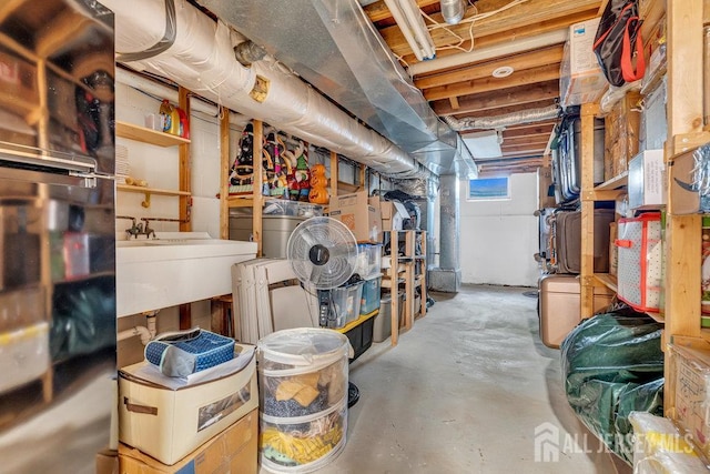 61 Lynn Ct, North Brunswick, NJ 08902 - basement featuring fridge and a sink
