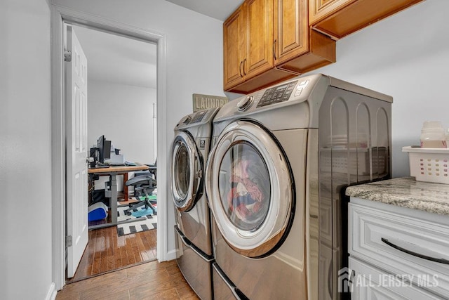 61 Lynn Ct, North Brunswick, NJ 08902 - washroom with washer and clothes dryer, cabinet space, light wood-style floors, and an office area