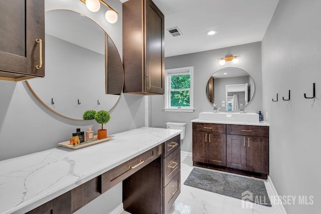 61 Lynn Ct, North Brunswick, NJ 08902 - bathroom featuring vanity, marble finish floors, and recessed lighting