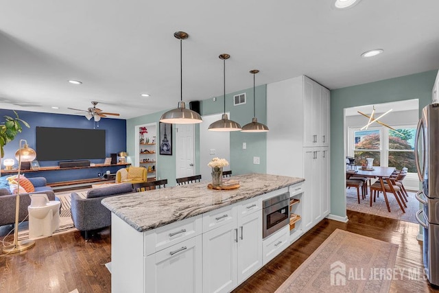 61 Lynn Ct, North Brunswick, NJ 08902 - kitchen featuring appliances with stainless steel finishes, light stone countertops, white cabinetry, a ceiling fan, and recessed lighting