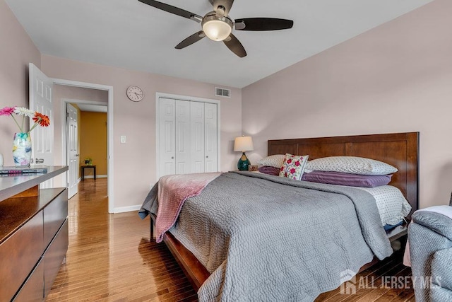 61 Lynn Ct, North Brunswick, NJ 08902 - bedroom featuring light wood-style flooring, a closet, and a ceiling fan