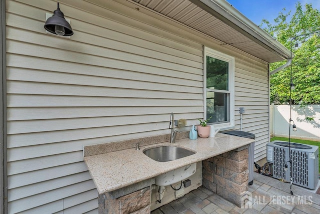 61 Lynn Ct, North Brunswick, NJ 08902 - view of patio / terrace featuring a sink