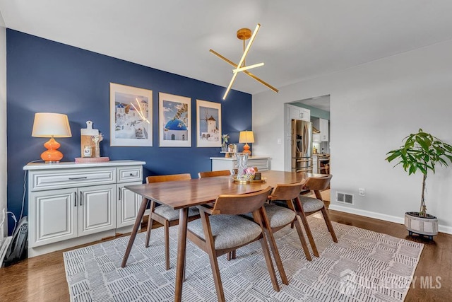 61 Lynn Ct, North Brunswick, NJ 08902 - dining room featuring wood finished floors and baseboards