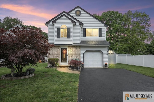 6 Shelley Rd, Old Bridge, NJ 08857 - traditional-style home featuring an attached garage, driveway, and brick siding