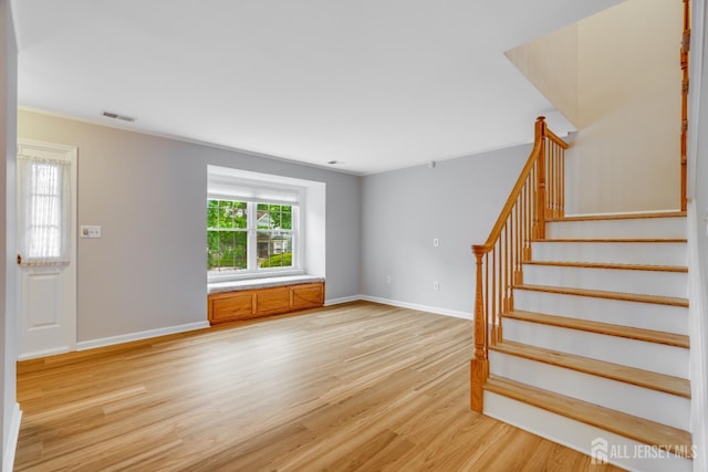 1604 Mulberry Ct, South Brunswick, NJ 08852 - unfurnished living room featuring light wood-style floors and stairs