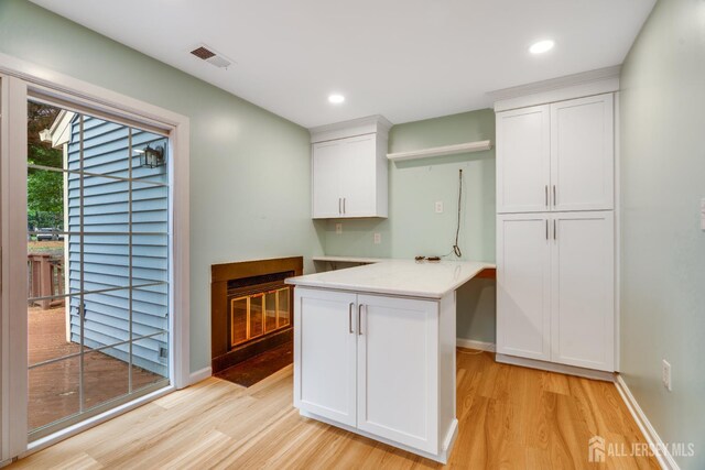 1604 Mulberry Ct, South Brunswick, NJ 08852 - kitchen featuring light wood-style flooring, white cabinets, light countertops, and recessed lighting