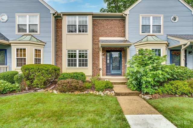 1604 Mulberry Ct, South Brunswick, NJ 08852 - traditional-style house with brick siding and a front yard