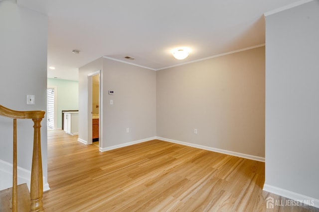 1604 Mulberry Ct, South Brunswick, NJ 08852 - spare room featuring light wood-style floors, ornamental molding, and stairs