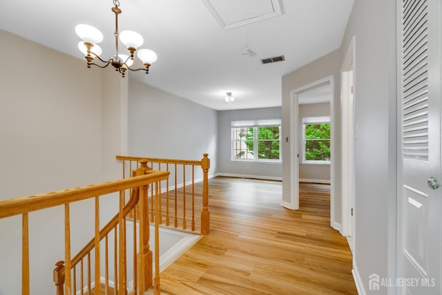 1604 Mulberry Ct, South Brunswick, NJ 08852 - hall with an upstairs landing, attic access, and light wood-type flooring