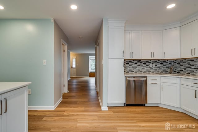 1604 Mulberry Ct, South Brunswick, NJ 08852 - kitchen with light wood finished floors, backsplash, dishwasher, white cabinets, and recessed lighting