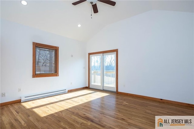 unfurnished room with wood finished floors, a baseboard heating unit, ceiling fan, and baseboards