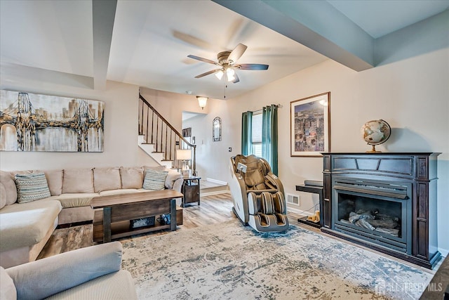97 Boehmhurst Ave, Sayreville, NJ 08872 - living area featuring stairs, a ceiling fan, wood finished floors, and a fireplace