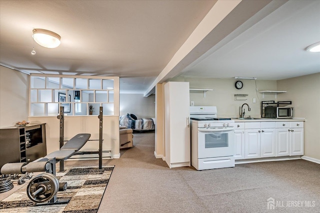97 Boehmhurst Ave, Sayreville, NJ 08872 - kitchen featuring white range, light colored carpet, white cabinetry, stainless steel microwave, and baseboard heating