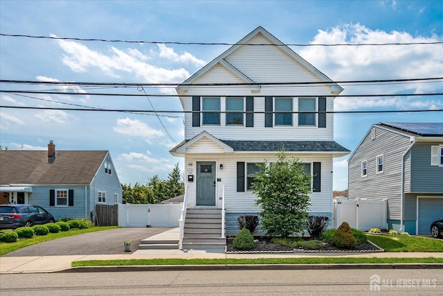 97 Boehmhurst Ave, Sayreville, NJ 08872 - view of front of home with a gate, asphalt driveway, and roof with shingles