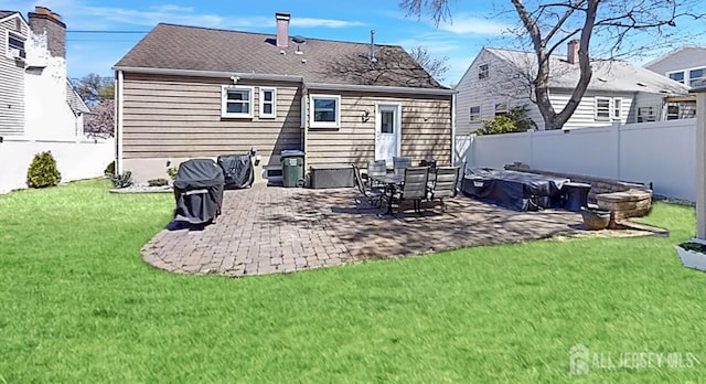 45 Maryknoll Rd, Menlo Park Terrace, NJ 08840 - rear view of house featuring a patio area, a chimney, a lawn, and a fenced backyard