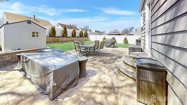 45 Maryknoll Rd, Menlo Park Terrace, NJ 08840 - view of patio featuring a jacuzzi, outdoor dining space, a storage shed, an outdoor structure, and a residential view