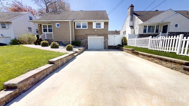 45 Maryknoll Rd, Menlo Park Terrace, NJ 08840 - view of front facade with stone siding, driveway, and an attached garage