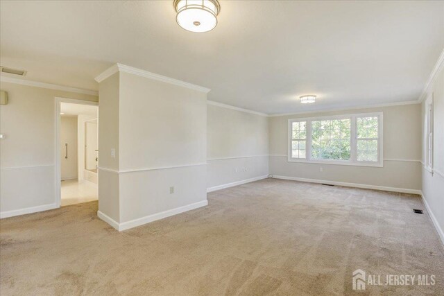 carpeted empty room with ornamental molding