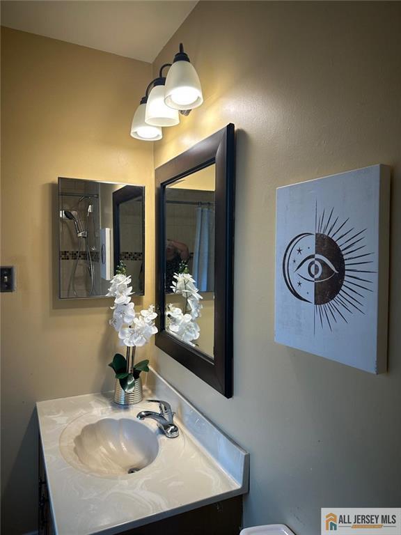 134 Hampshire Dr, Plainsboro, NJ 08536 - bathroom featuring vanity and curtained shower