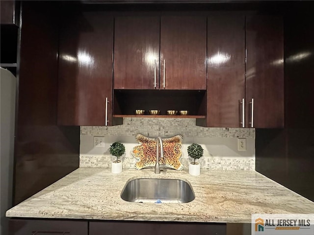 134 Hampshire Dr, Plainsboro, NJ 08536 - kitchen with backsplash, open shelves, light stone counters, and dark brown cabinets