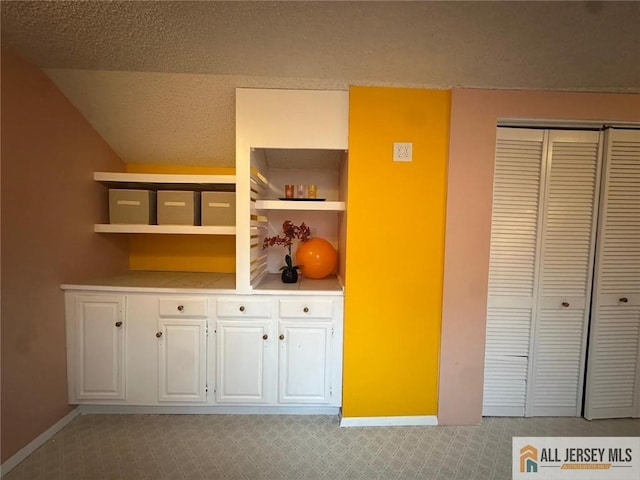 134 Hampshire Dr, Plainsboro, NJ 08536 - corridor featuring light colored carpet and lofted ceiling