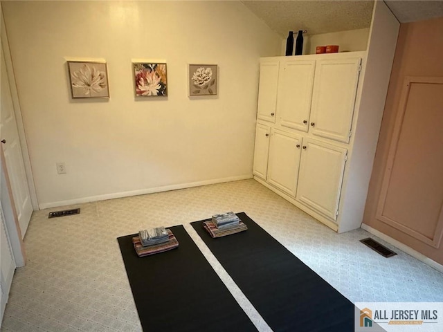 134 Hampshire Dr, Plainsboro, NJ 08536 - workout room featuring light carpet and lofted ceiling