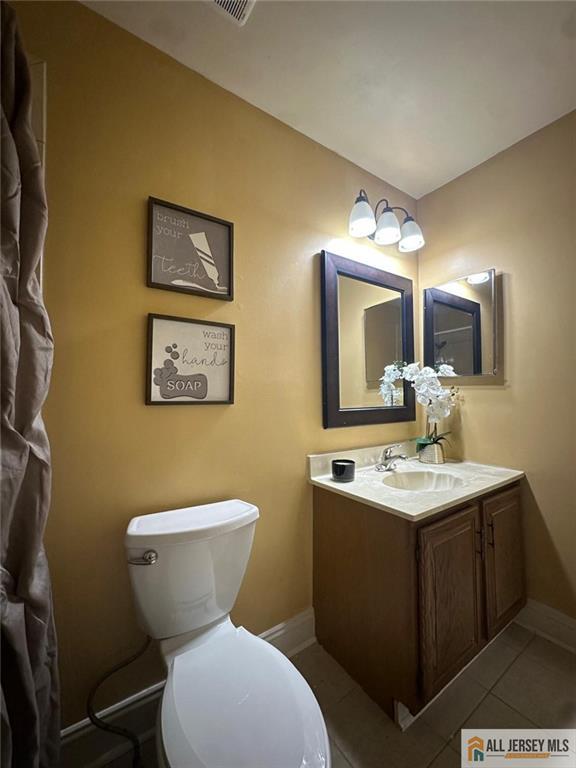134 Hampshire Dr, Plainsboro, NJ 08536 - bathroom featuring vanity and tile patterned flooring