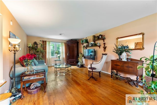 14 Devon Rd, Edison, NJ 08820 - living area featuring light wood-style flooring and baseboards